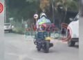 Graban a un agente de tránsito usando el celular mientras conducía y, al parecer, cruzando semáforos en rojo en Ibagué